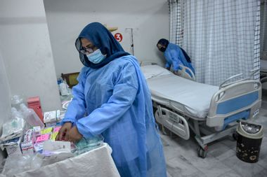 Health workers prepare an isolation ward for mpox patients