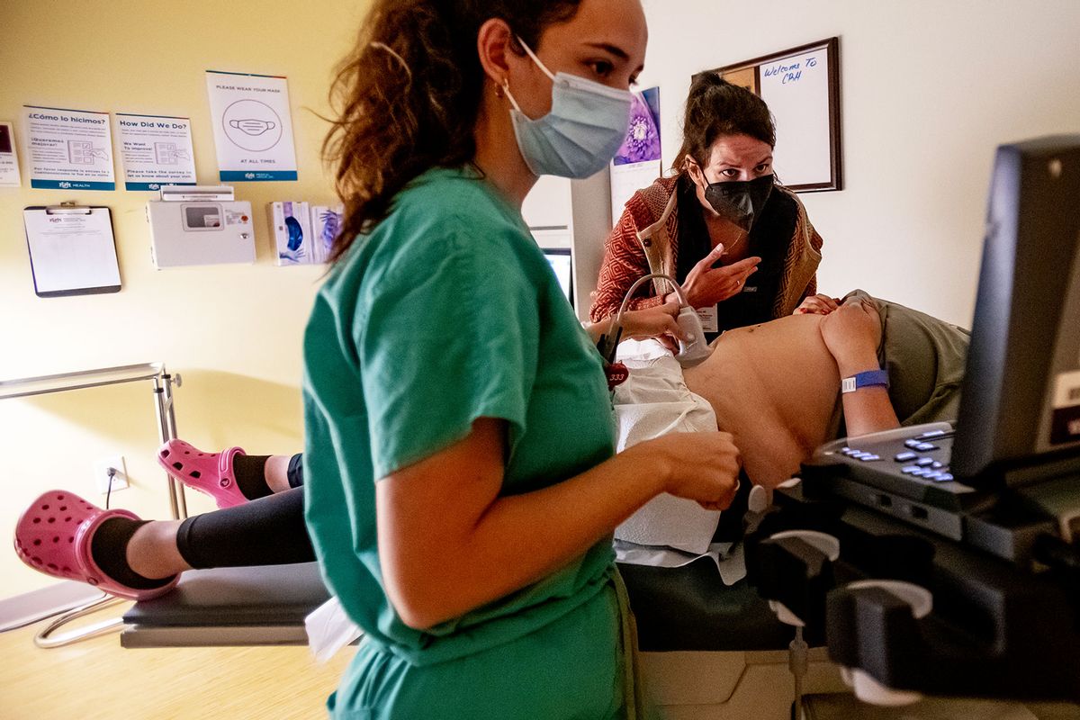 A family physician and her resident perform an ultrasound on a 25-year-old woman the day before the Supreme Court overturned Roe v. Wade at the Center for Reproductive Health clinic on June 23, 2022 in Albuquerque, New Mexico. (Gina Ferazzi / Los Angeles Times via Getty Images)